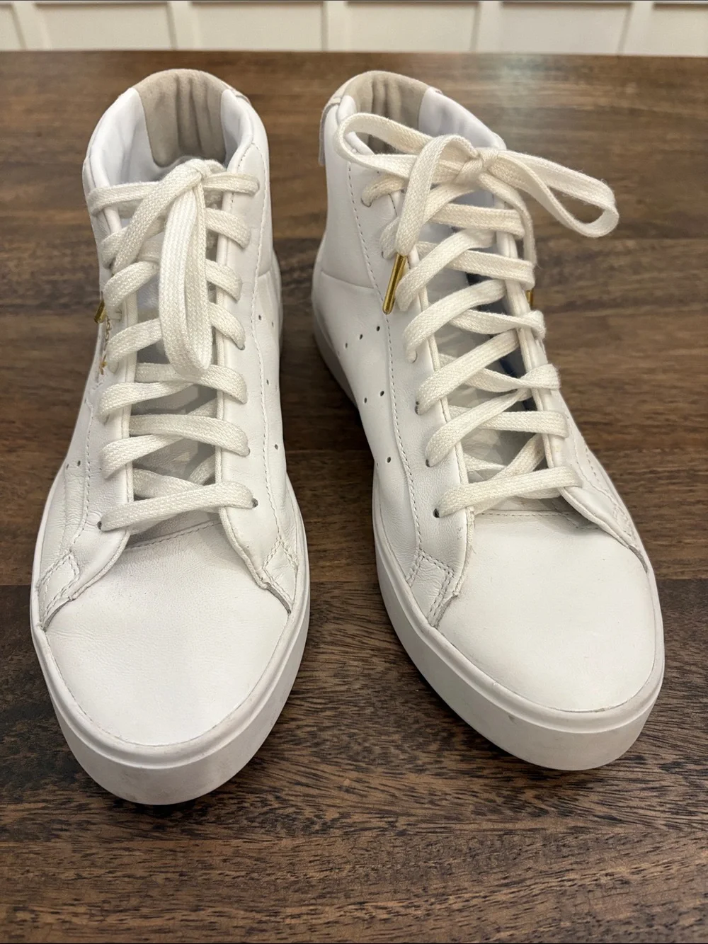 adidas White High-Top Sneakers with Gold Accents